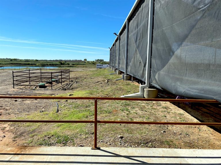 Out to the right of the of office